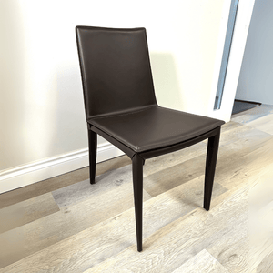 Dark brown bonded leather restaurant chair with a modern low back and tapered legs, ideal for dining areas.