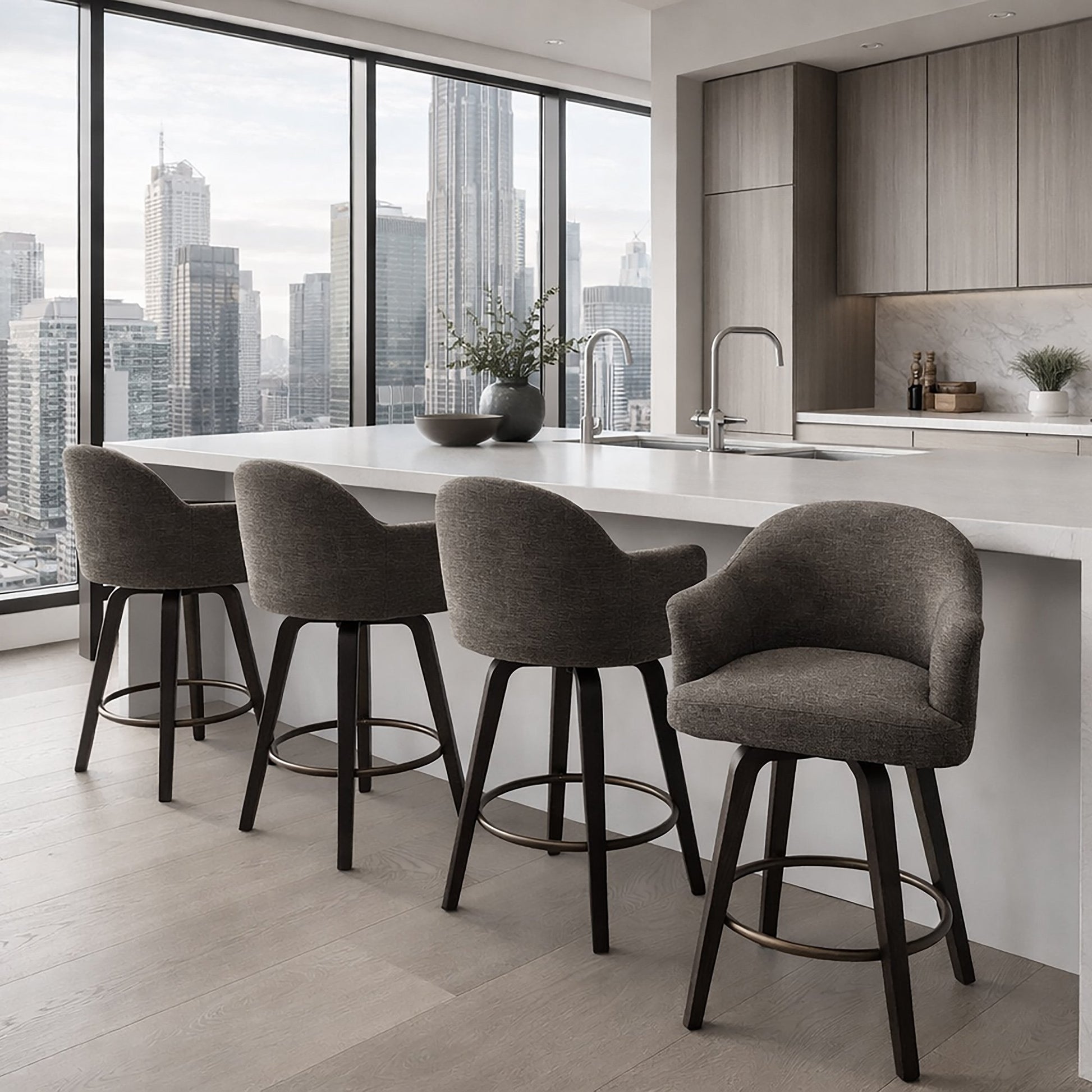 Torra set of 2 warm charcoal upholstery swivel counter stools with dark walnut legs at a modern kitchen island.