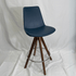 Eiffel Blue Swivel Bar Stool featuring wooden tripod legs, chrome footring, and blue upholstered seat.