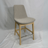 Eiffel HB Beige Boucle Counter Stool with Eiffel silhouette, high back, light wood legs and chrome footrest.