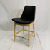 Eiffel HB Black Leather Counter Stool with light wood legs and chrome footrest, iconic silhouette.