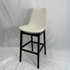 Eiffel HB cream leather bar stool with sculpted back and black wood legs in a geometric silhouette.