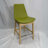Eiffel HB green leather counter stool with back, light oak legs and chrome footrest.