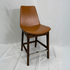 Eiffel HB tan leather bar stool with back, mid-century design, dark wood legs, chrome footrest.