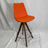 Eiffel Orange Swivel Bar Stool with orange upholstery, wood legs, chrome circular footrest, 360-degree swivel.